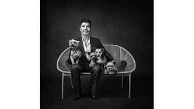 ONE USE ONLY  Simon Cowell with Squiddly, Diddly, Freddy and Daisy  Celebrity portrait photographer Andy Gotts has created a series of stunning images of the UK's most famous faces - and their dogs.   Must Credit: Andy Gotts / Guide Dogs